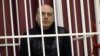 Fashion designer Sasha Varlamau attends the opening court hearing during his trial in Minsk on February 4.