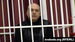 Belarusian fashion designer Sasha Varlamau appears in court during his trial on fraud and other charges in Minsk on February 4.