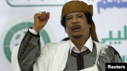 Muammar Qaddafi is the subject of an Interpol alert