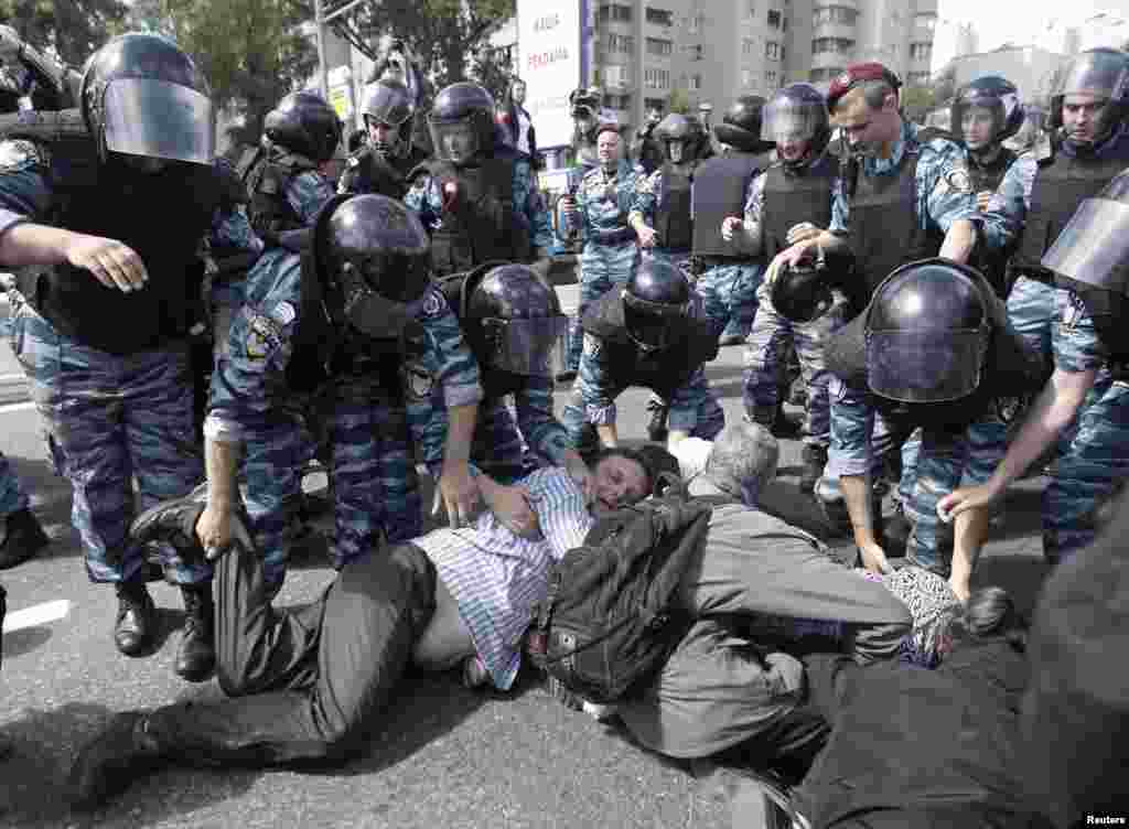 Riot police arrest Orthodox Christian activists trying to prevent the march.&nbsp;