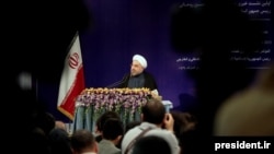 Iran's Hassan Rohani at his first press conference as president on August 6