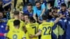 Kosovar players celebrate with fans after their second goal in a match against Bulgaria in June. Kosovo won 3-2.