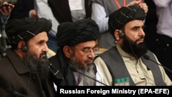 Mullah Abdul Ghani Baradar (center), the Taliban's deputy leader and chief negotiator, attends an international peace conference in Moscow on March 18 with members of a Taliban delegation.