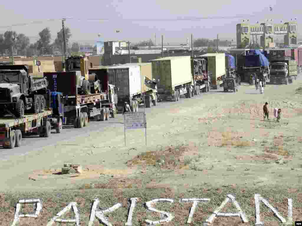 Trucks carrying the supplies for NATO forces in southwestern Afghanistan await clearance at the Pakistani border with Afghanistan in Chaman in September 2009.