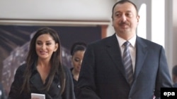 President Ilham Aliyev and his wife, Mehriban, arrive at a polling station in Baku to vote in the referendum.