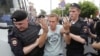 Policemen detain Russian opposition leader Aleksei Navalny in June 2019. Navalny's situation was cited leading rights groups who have slammed Moscow's "harassment and prosecution of peaceful political and civil society activists, protesters and other dissenting voices in Russia."