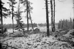 Soviet tanks (on road in background) advance into Finnish territory on December 17.