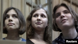 Members of the Pussy Riot punk band whose case has been sent to court (left to right): Nadezhda Tolokonnikova, Maria Alyokhina, and Yekaterina Samutsevich