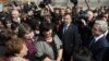 Armenian President Serzh Sarkisian (far right) talks to residents of the village of Akhuryan during a working visit on April 7, a month before national elections.