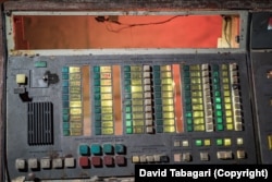 An apparent communications switchboard, with the names of several Georgian cities, in an underground shelter.