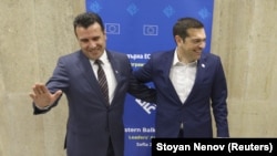 Greek Prime Minister Alexis Tsipras (right) meets with Macedonian Prime Minister Zoran Zaev at the EU-Western Balkans summit in Sofia on May 17.