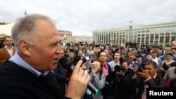 Belarusian opposition leader Mikalay Statkevich delivers a speech during a protest rally on Belarusian Independence Day in Minsk on July 3. 