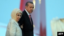 Turkish Prime Minister Recep Tayyip Erdogan and his wife, Emine, step off the plane upon their arrival in Tunis on June 5. 