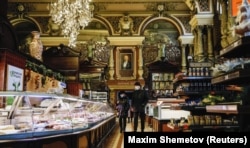 Customers browse at Yeliseyevsky a few days before it closed down. The portrait on the wall is of the store's founder, Grigory Yeliseyev (1864-1949).