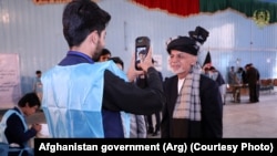 Incumbent Ashraf Ghani casts his vote in a voting center in Kabul.