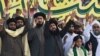 Tehrik-e Labaik Pakistan leader Saad Rizvi (center) meets with supporters in January.