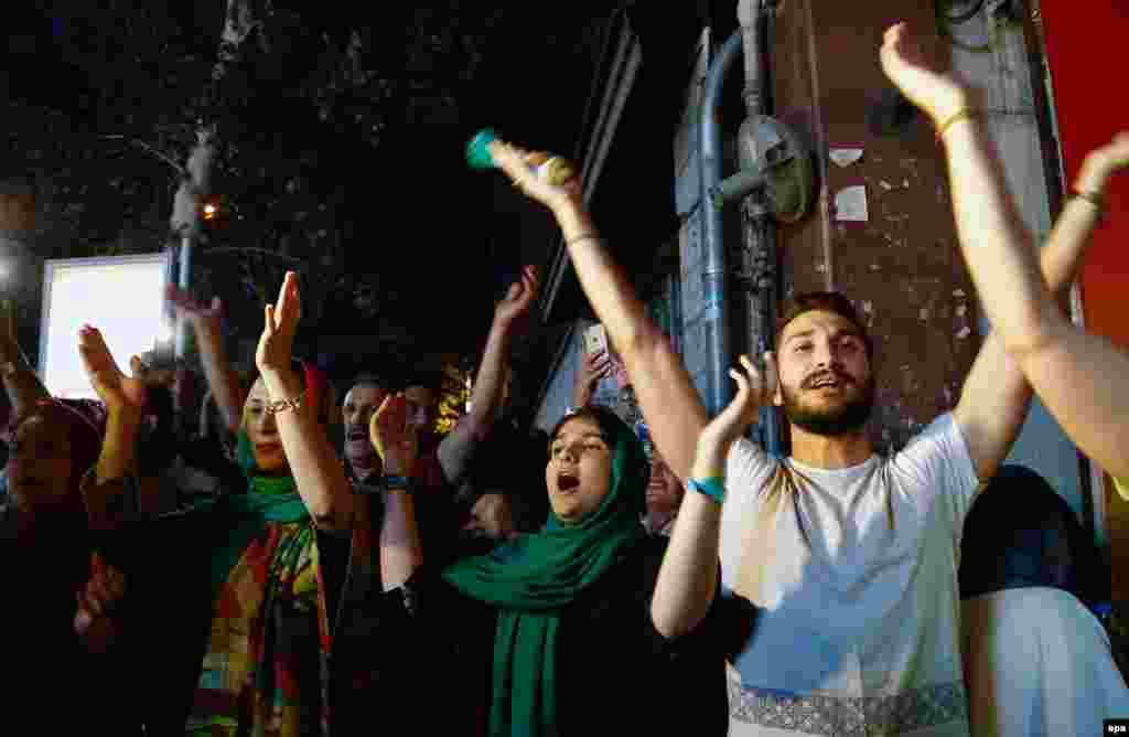 Iranians celebrate in Tehran on July 14 after officials struck a deal on limiting the country&#39;s nuclear program in exchange for the easing of sanctions.