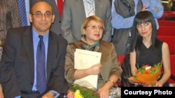 Arif (left to right), Leyla, and Dinara Yunus attend a human rights award ceremony. (undated)