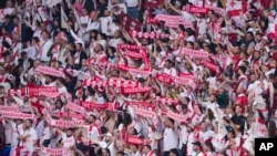 Georgian soccer fans cheer on the national team at the Euro 2024 tournament in Germany, 