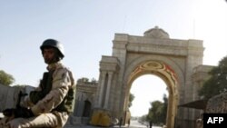 An Iraqi soldier drives through Baghdad's fortified Green Zone on January 1, the same day U.S. forces handed over official control of security there to Iraq.