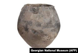 An image released by the Georgian National Museum on November 13 shows a Neolithic jar from Khramis Didi-Gora, Georgia. Pottery fragments from 8,000-year-old jars unearthed near Tbilisi are the earliest evidence of winemaking in the Near East.