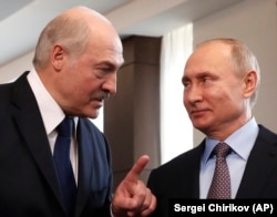 Belarusian President Alyaksandr Lukashenka (left) speaks with Putin in Sochi on February 15.