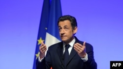 President Sarkozy announcing France's return to the NATO inner circle in Paris on March 11.