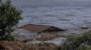 The roof of a house is seen in the Dnieper River, which flooded after Ukraine's Nova Kakhovka dam was breached on June 6.