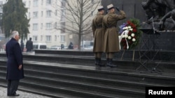 U.S. Secretary of State Rex Tillerson (left) takes part in a wreath-laying ceremony to commemorate International Holocaust Remembrance Day at the Warsaw Ghetto monument in Poland on January 27. 