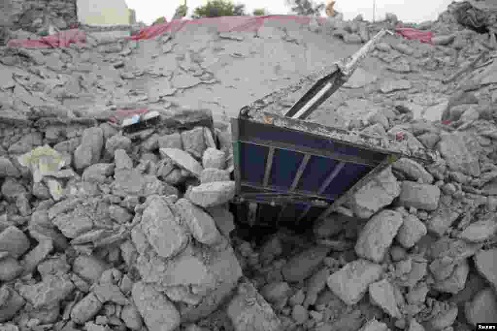 The rubble of a house after it collapsed in the town of Awaran.