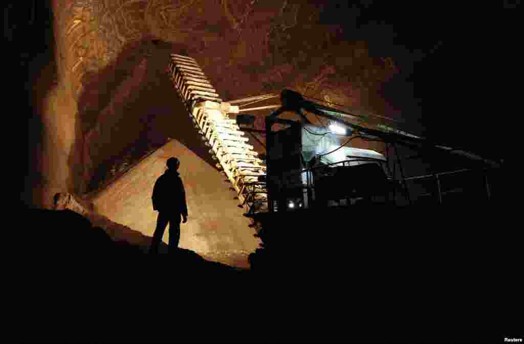 Employees work inside a Uralkali potash mine near the city of Berezniki in the Perm region, close to the Ural Mountains.