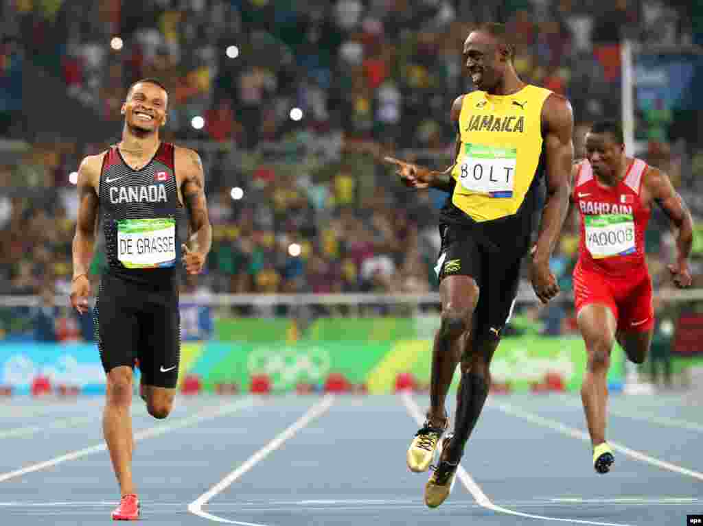 Sprinter Usain Bolt (center) of Jamaica reacts after winning the men&#39;s 200-meter semifinals at the Rio Olympics.&nbsp;Bolt declared himself &ldquo;the greatest&rdquo; during the games, which saw him haul in three gold medals to bring his Olympic career total to nine.