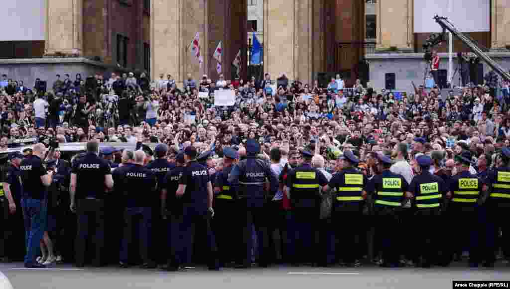 Scores of police attempted to stop the crowds from blocking Rustaveli Avenue on June 1 but eventually ceded the road to the thousands of protesters, a larger crowd than the night before.