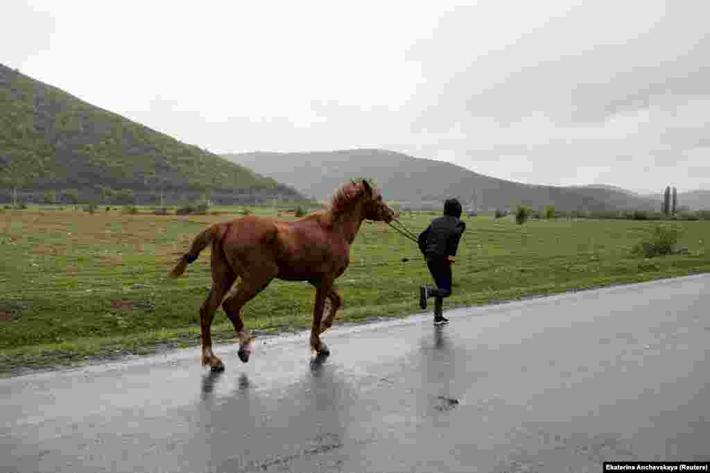 A boy jogs his horse toward Duisi. Anchevskaya says that despite its troubled history she feels a deep affinity for the gorge, and she urges other people to experience it for themselves.