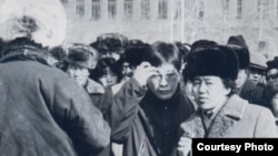 Pro-democracy leader Sanjaasuren Zorig (center, with glasses) and Tsakhiagiin Elbegdorj, the current president of Mongolia, standing on Ulan Bator's central Sukhbaatar Square during the 1990 demonstrations.