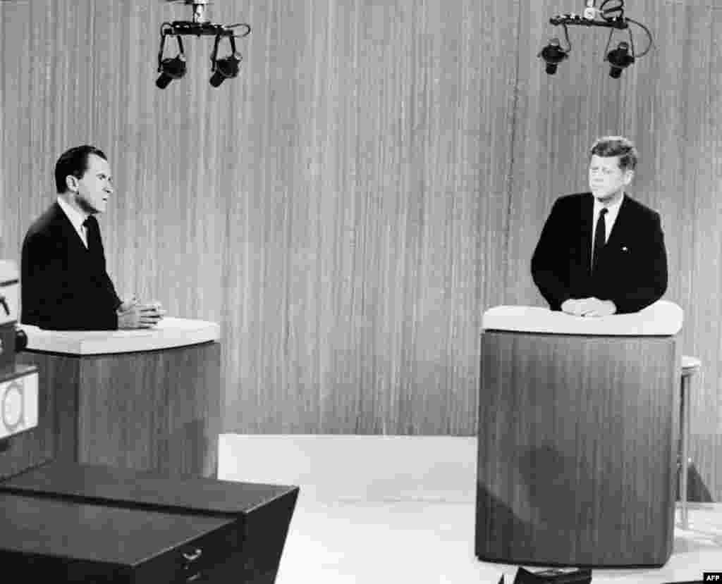 The Republican Party nominee, U.S. Vice President Richard Nixon, and his Democratic challenger, U.S. Senator John Kennedy, discuss their differences in the first nationally televised debate between presidential candidates, in a Chicago television studio, on September 26, 1960.