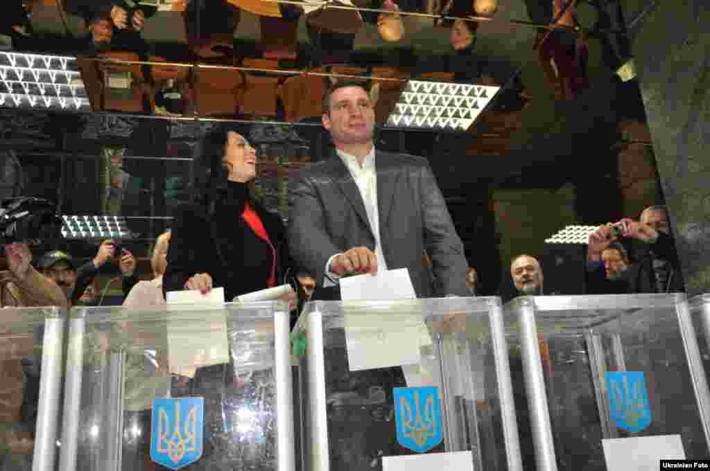 Udar party leader Vitali Klitschko, who is still a reigning world heavyweight champion, votes at a Kyiv polling station.