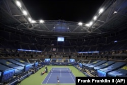 The stands of Arthur Ashe Stadium sit nearly empty as Novak Djokovic of Serbia serves to Damir Dzumhur of Bosnia-Herzegovina during the first round of the US Open tennis championships in New York on August 31.