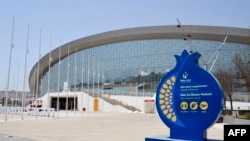 State workers have told RFE/RL that they have been forced to help foot the big bill for the European Games, in an effort to fund such venues as the Aquatics Center (above).