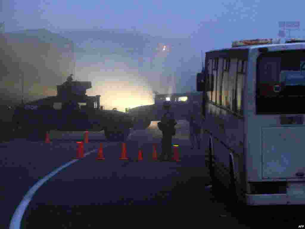 KFOR peacekeepers guard the burned-down Jarinje checkpoint on January 28.