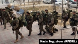 Kazakh Interior Ministry troops patrol in Aqtau, the regional capital of the western region, on December 21.