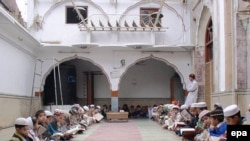 Madrasah students study at a mosque in Peshawar, Pakistan.