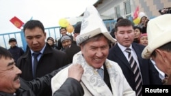 Kyrgyzstan's President-elect Almazbek Atambaev (centre) on the campaign trail last month. 