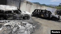 Burned-out Kosovo police vehicles at the Serbia-Kosovo border crossing in Jarinje following violent ethnic clashes in July. 