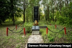 Zherdnaye, Belarus. The inscription on the black granite memorial reads "1941-1945. The grateful homeland will forever be proud of the heroic deeds of its brave sons and daughters.”