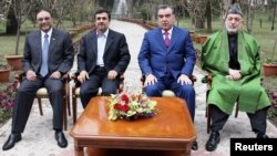 From left to right, Pakistan's President Asif Ali Zardari, Iran's President Mahmud Ahmadinejad, Tajikistan's President Imomali Rahmon and Afghan President Hamid Karzai pose for pictures during a regional conference in Dushanbe.