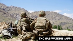 U.S. soldiers look out over hillsides in the Nerkh district of Wardak Province. (file photo)