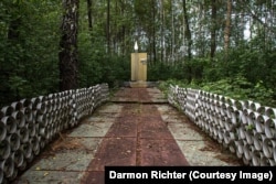 Rudnya Illinetska, Ukraine. This painted wooden monument marks the place where a Soviet fighter pilot was downed during the war. The original inscription reads: “Passerby! Bend your head before the grave where the remains lie of an unknown Soviet pilot killed on October 4, 1943, when our homeland was liberated from German fascist invaders.”