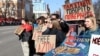 Relatives and friends of Ukrainian prisoners of war from the Azov Brigade hold placards during a rally in the center of Kyiv on March 10 calling for an exchange with Russian prisoners.