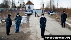 Police officers wearing face masks to protect against the coronavirus guard an entrance to Correctional Colony No. 2 in Pokrov on April 6.